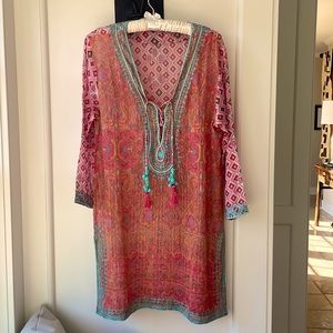 Long sleeve, caftan with tassel front and gold thread running through it.